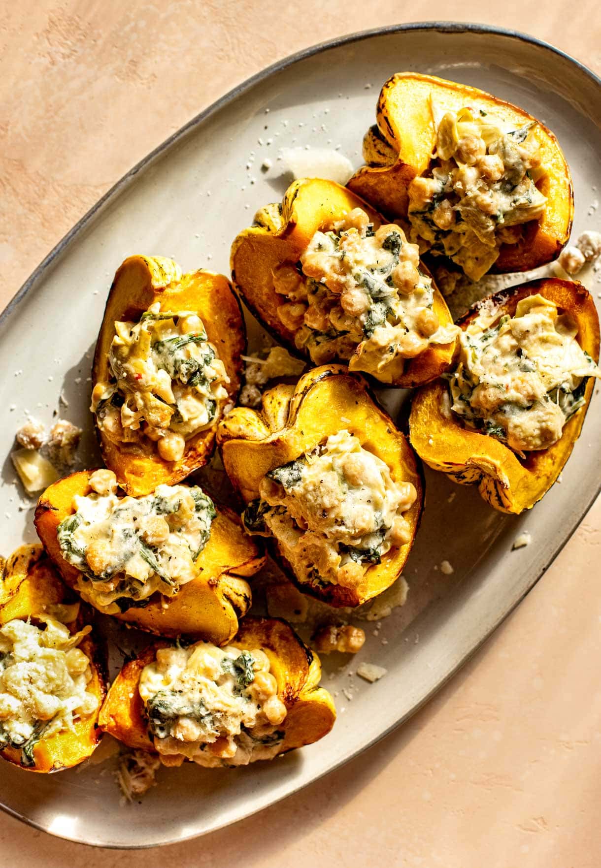 roasted carnival squash stuffed with spinach artichoke dip