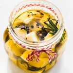 olive oil marinated cheese in a clear jar