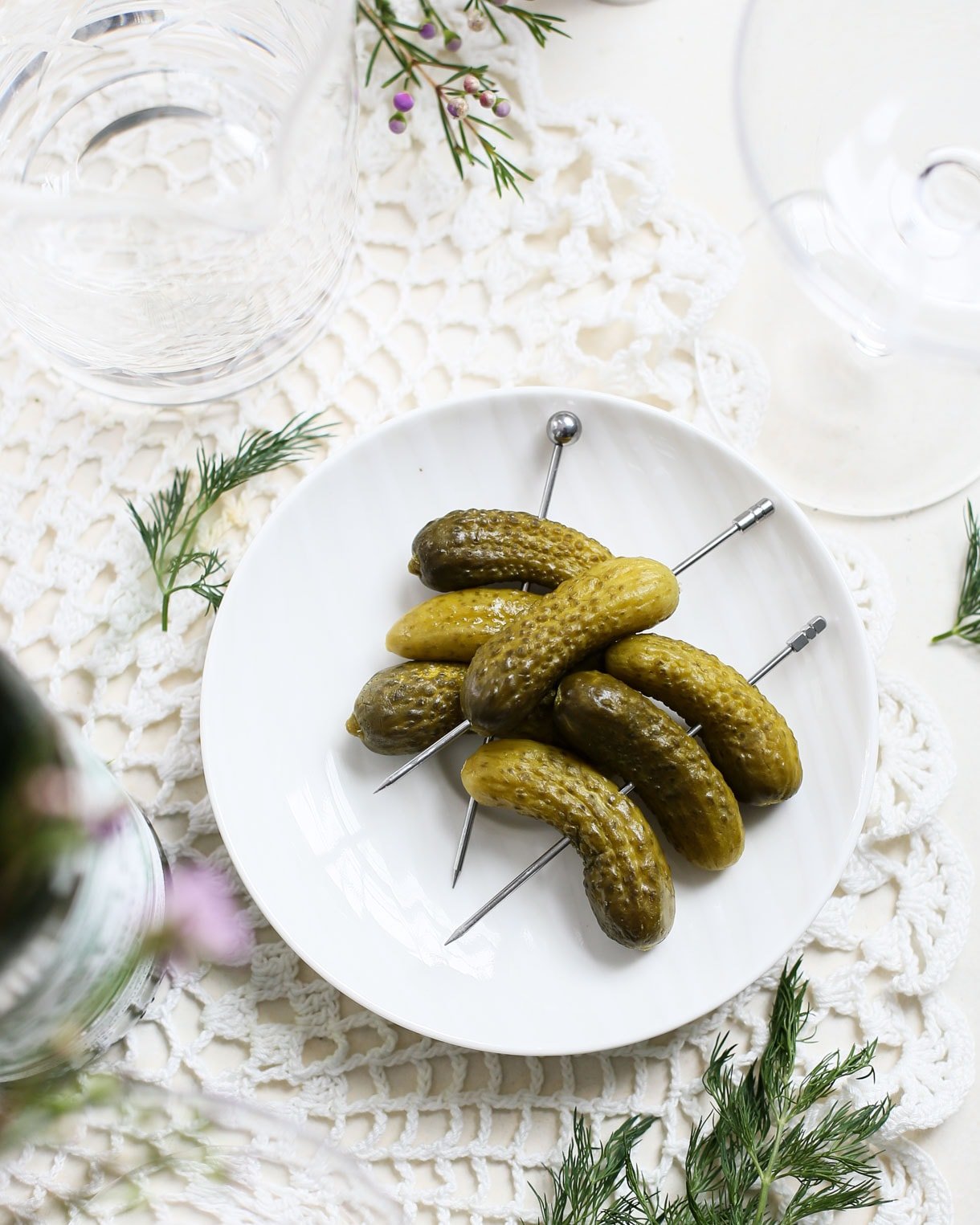 cornichon pickles on a white plate