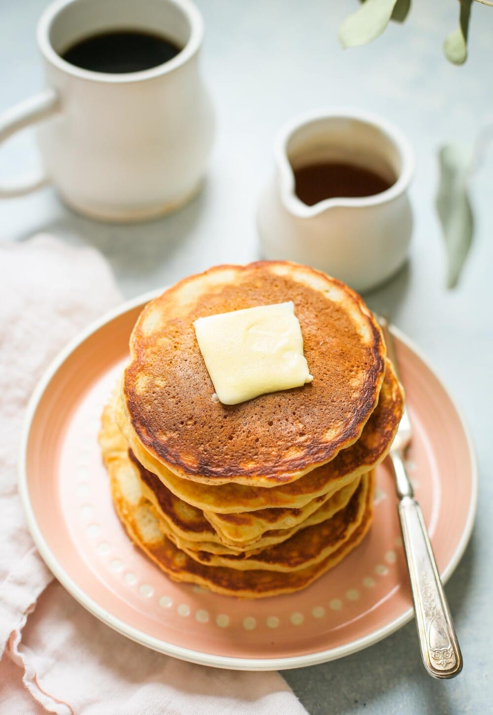 sourdough pancake stack on pink plate. 
