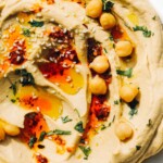 spicy hummus on white plate
