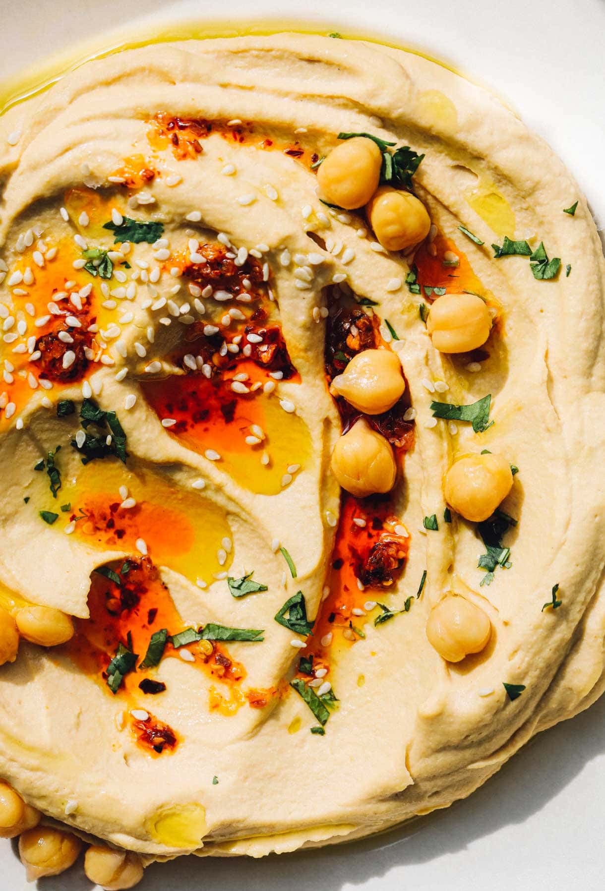 spicy hummus on white plate