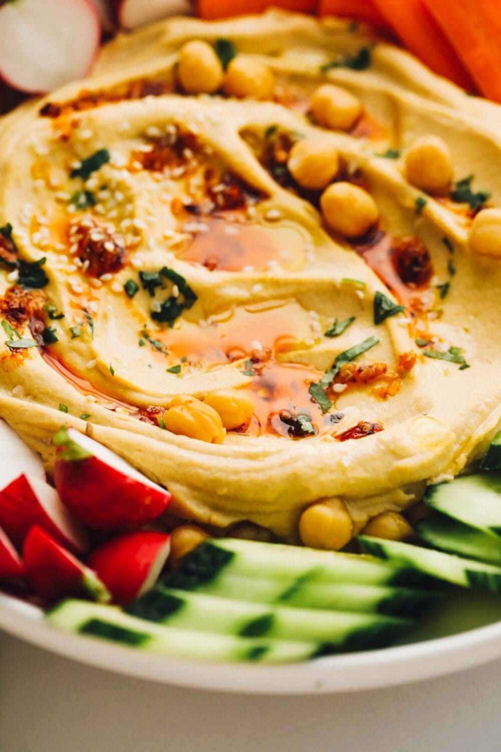 hummus on a platter with vegetables