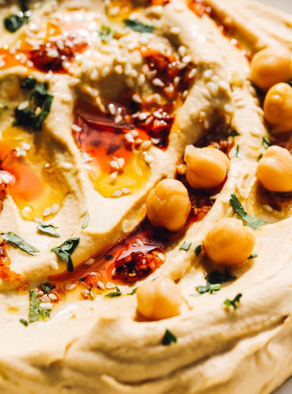 https://heartbeetkitchen.com/foodblog/wp-content/uploads/2023/03/spicy-hummus-7-1000x1348.jpg