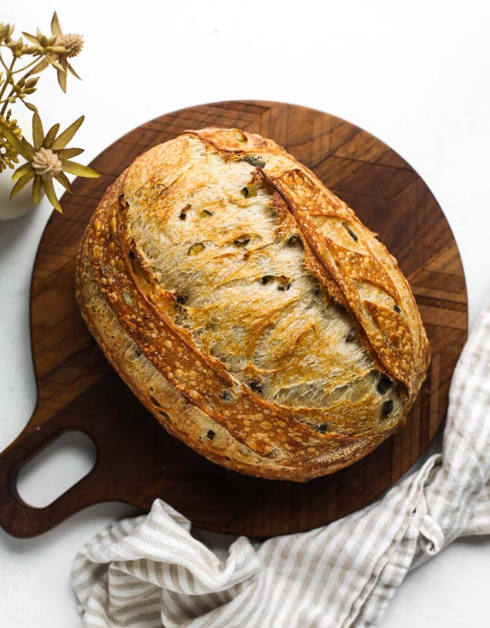 Dill pickle sourdough on a wooden cutting board