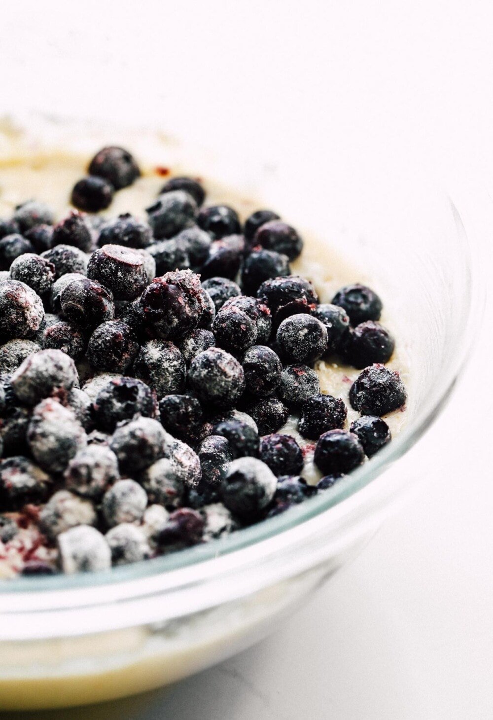 gluten-free blueberry muffin batter in clear bowl