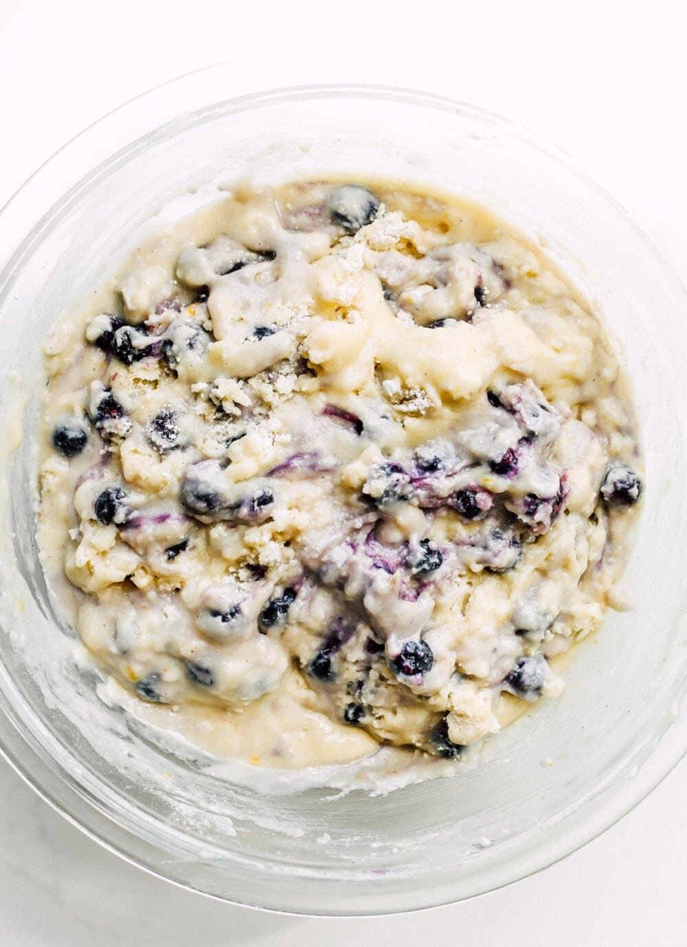 gluten-free blueberry muffin batter in clear bowl