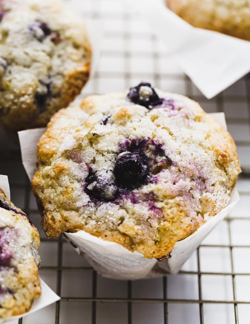 gluten-free blueberry muffins on a wire cooling rack