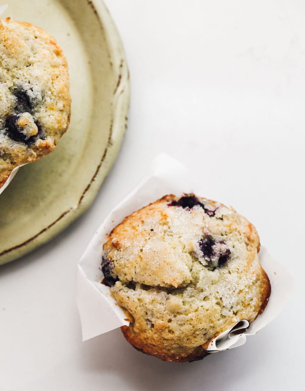 gluten-free blueberry muffin on white surface