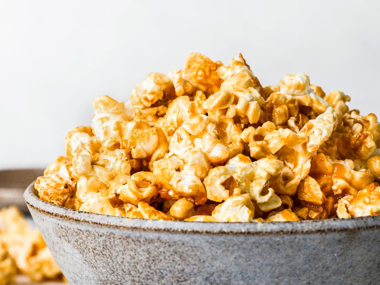 healthy caramel corn in grey bowl