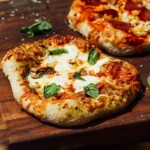 sourdough pizza made on a wooden cutting board