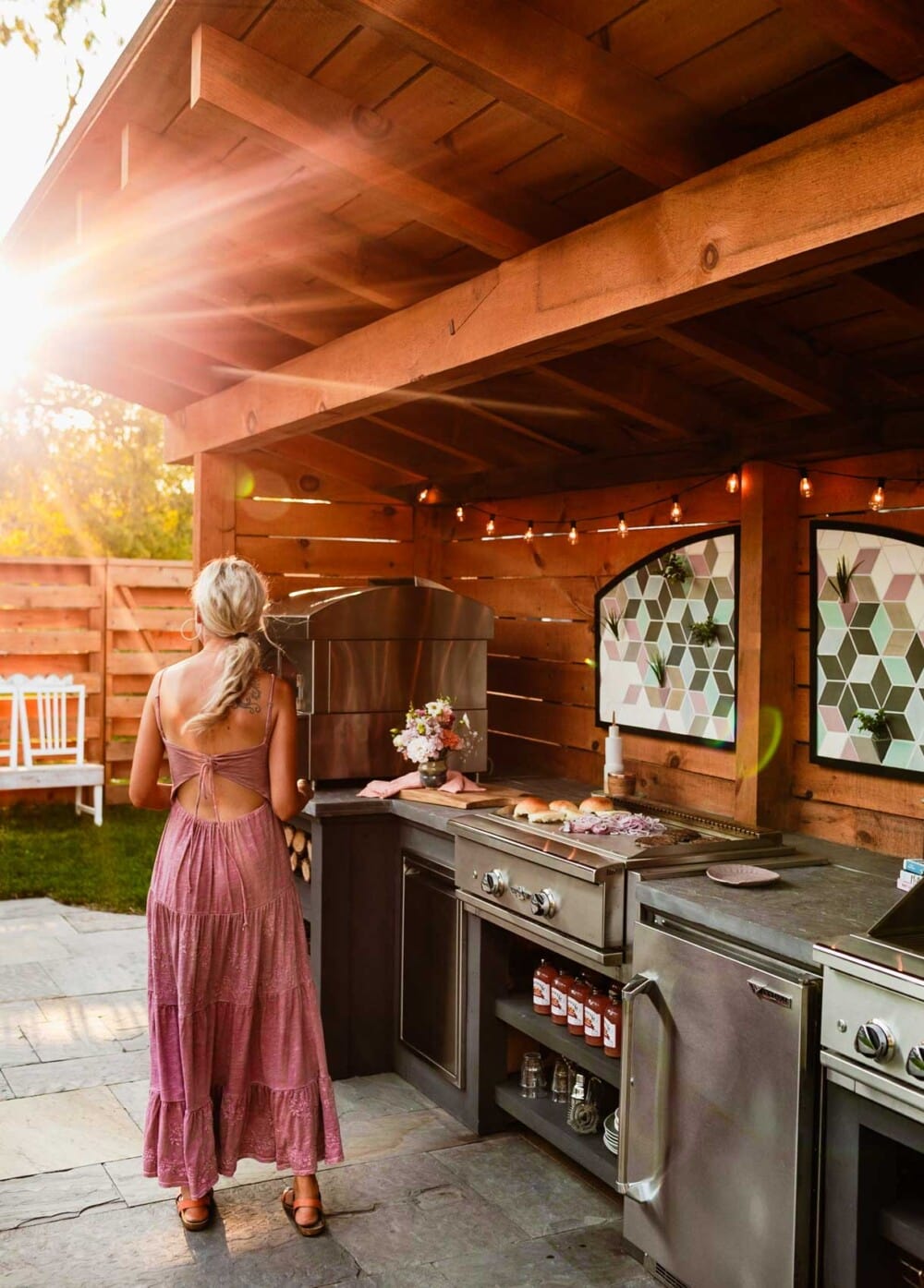 outdoor kitchen with woman cooking