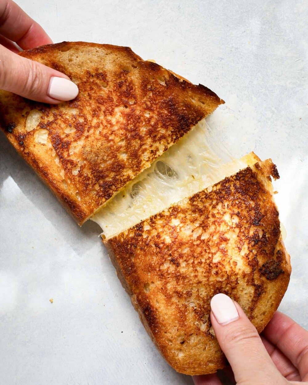 sourdough grilled cheese being pulled apart