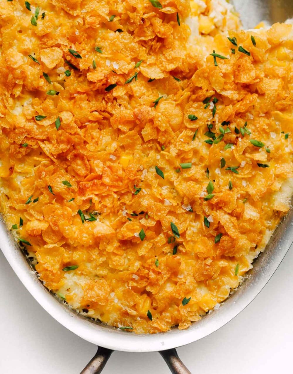 baked corn with cornflake topping in casserole dish