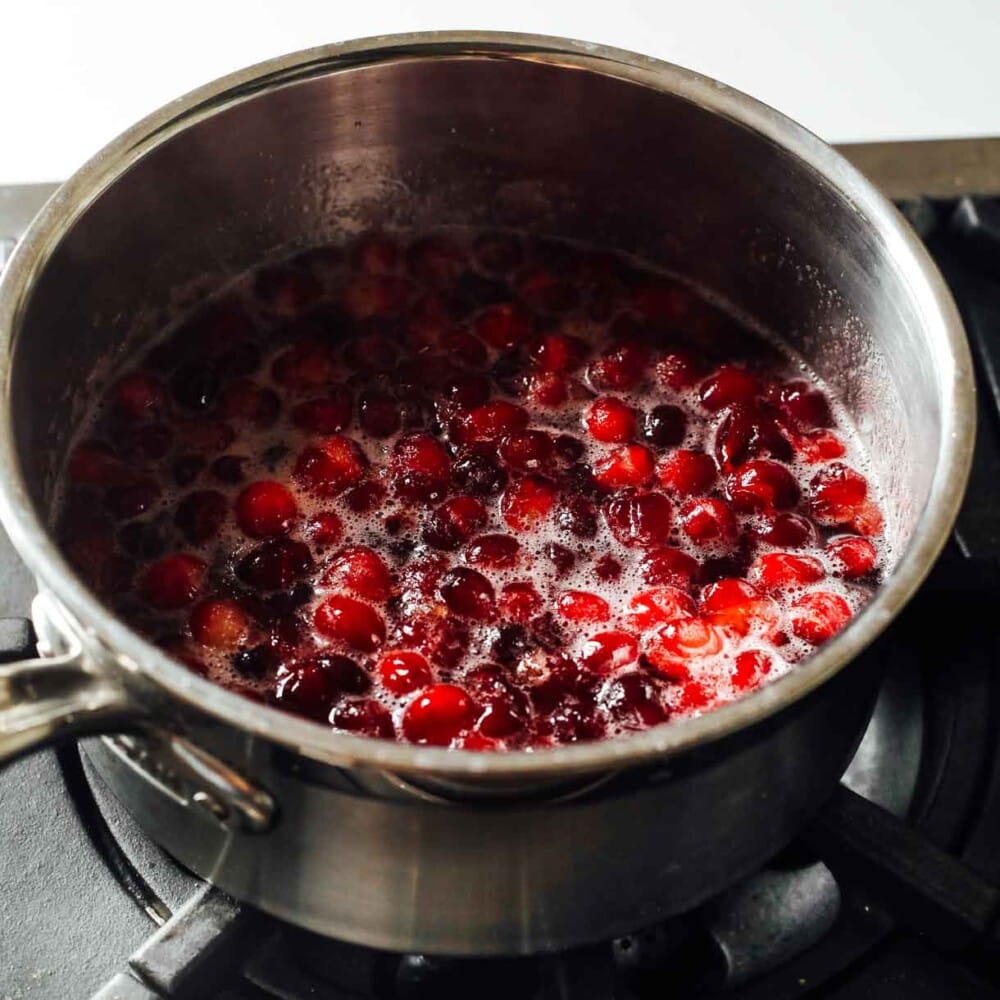 cranberry syrup being made in a pot