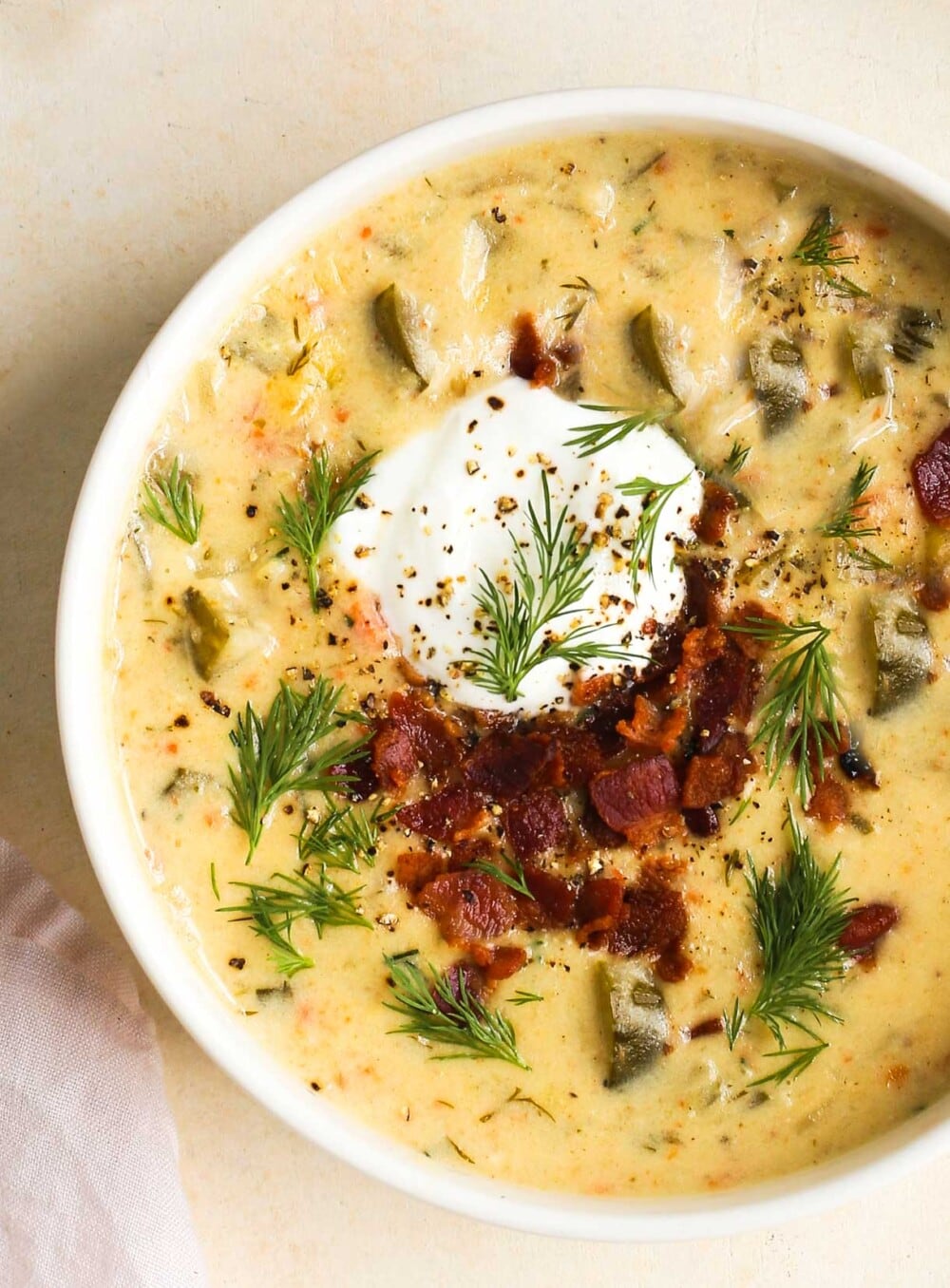 bacon dill pickle soup in white bowl