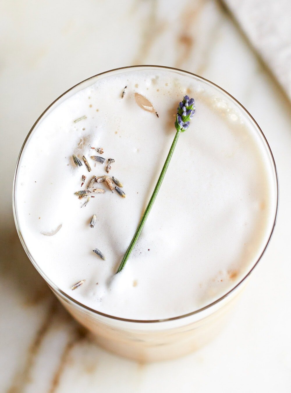 iced lavender latte in clear glass 