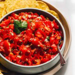 cherry tomato salsa in a bowl with spoon