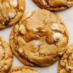 sourdough white chocolate macadamia nut cookies on parchment paper