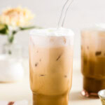 iced vanilla latte with a glass straw