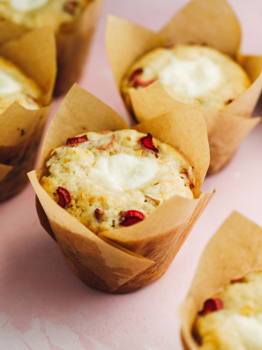 sourdough rhubarb muffins in paper liners