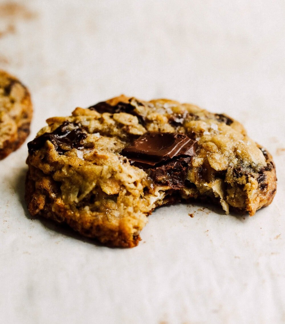 oatmeal chocolate chip cookie with bite out of it