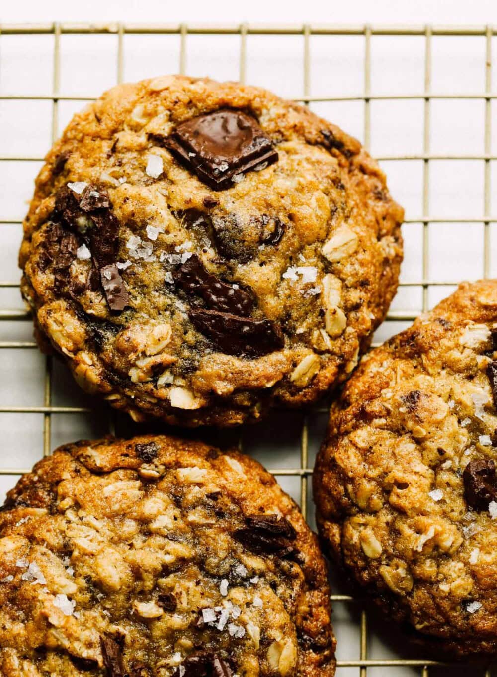 sourdough oatmeal chocolate chip cookies on wire rack