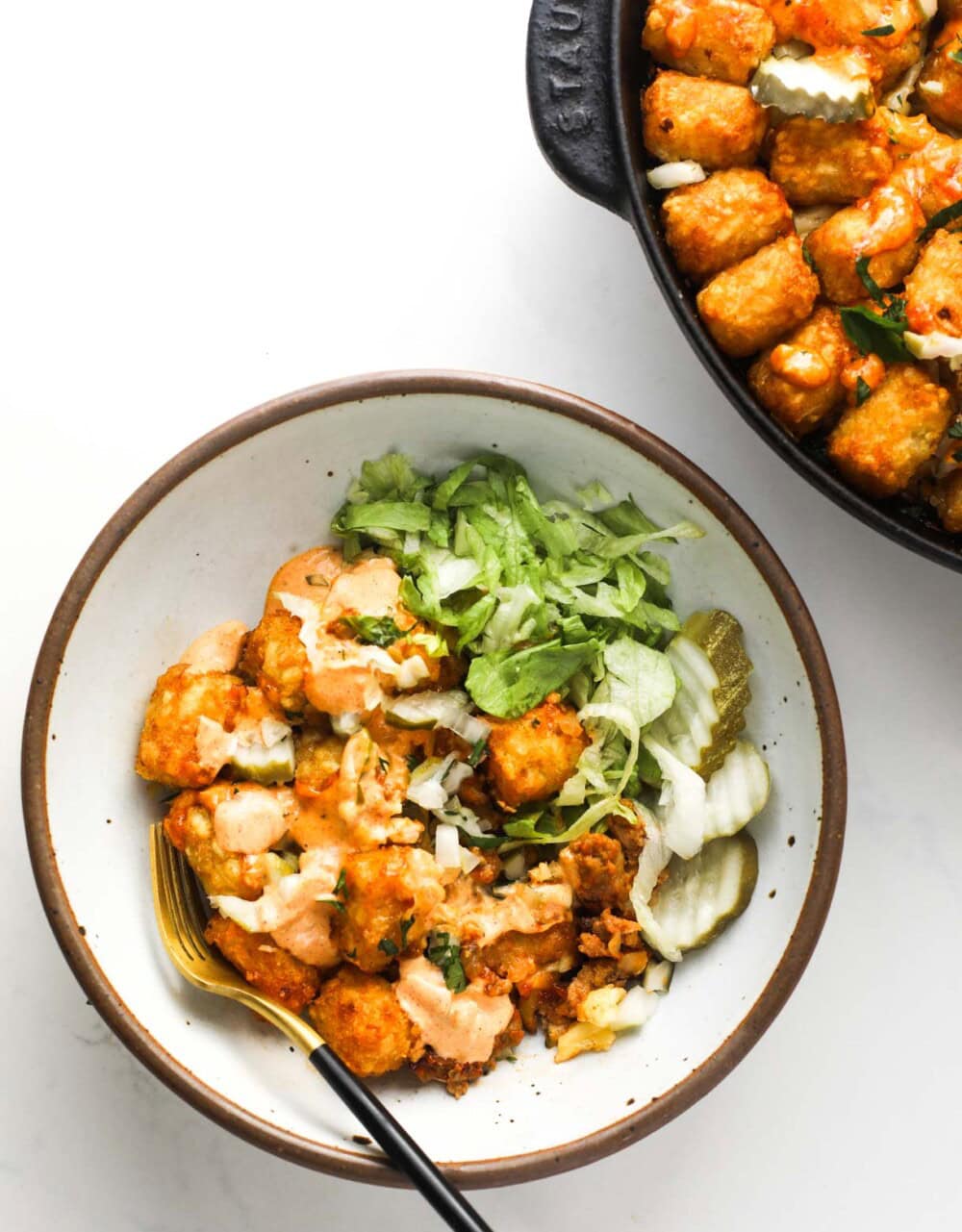 bowl of cheeseburger casserole in white bowl next to the full plan