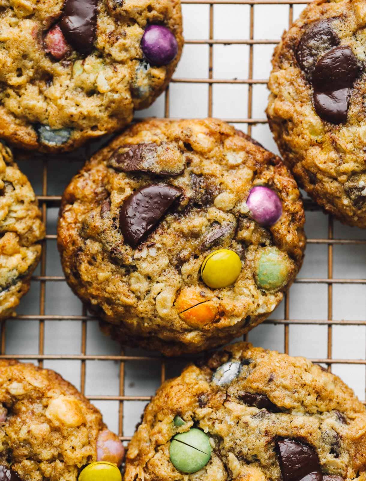 sourdough monster cookies on a wire cooling rack