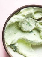 jalapeno cream cheese in a bowl with a gold spoon