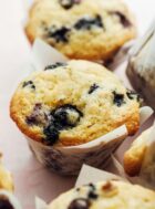 blueberry sourdough muffins in white liners